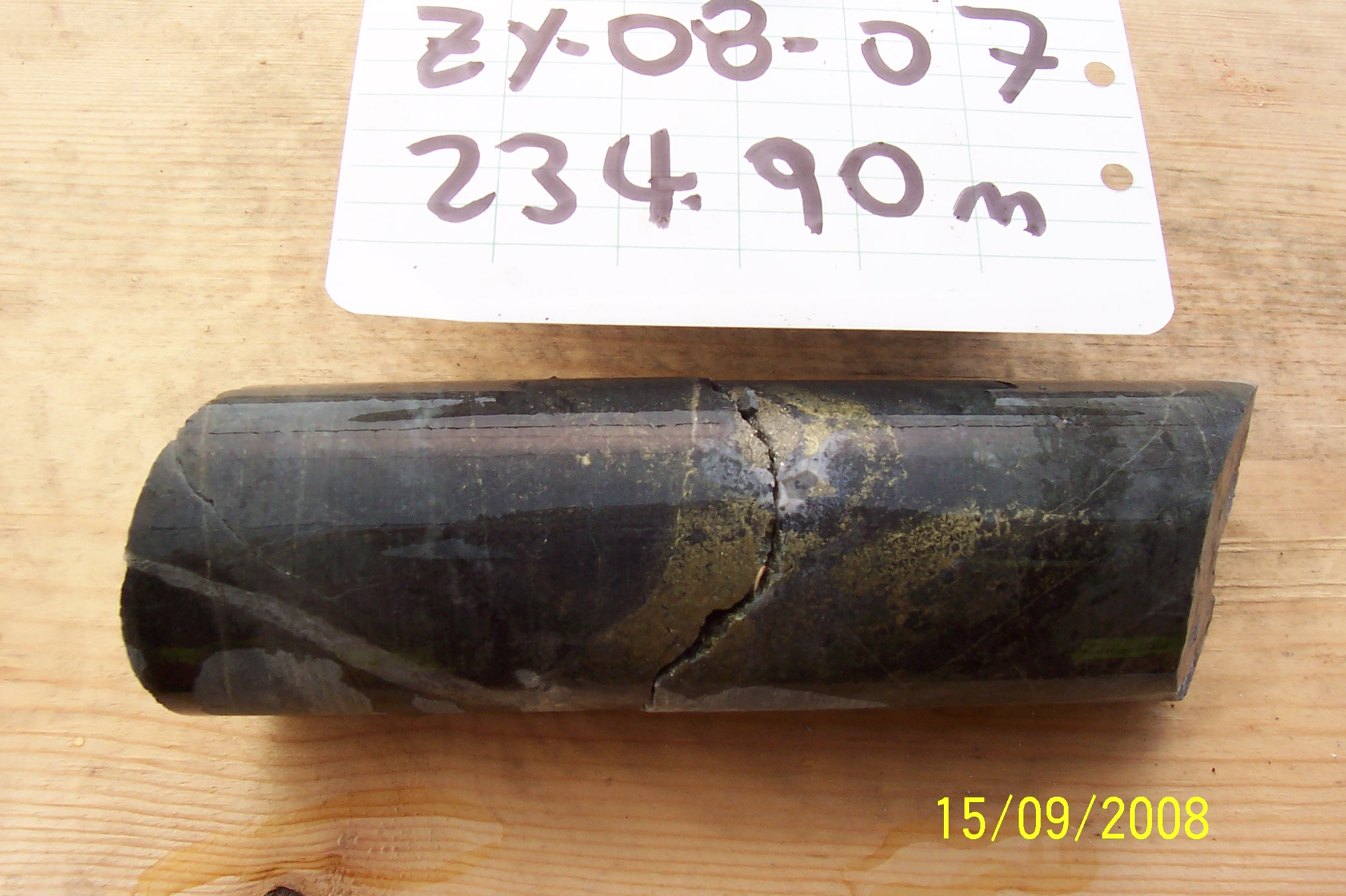 Drill core from hole ZY-08-07 at 234.90 metres depth, Zymo property, with hand-labelled core board